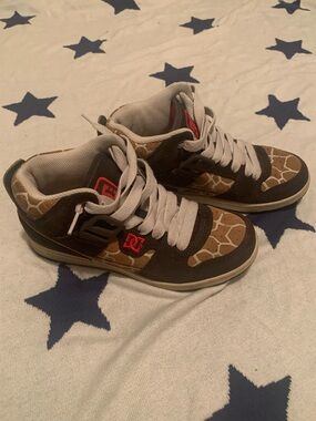 DC womens giraffe print sneakers with Red Logo